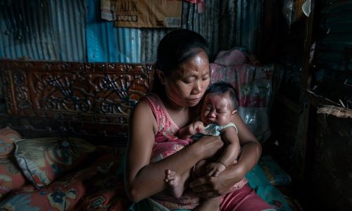 StockCake-Mother holding baby_1723887914